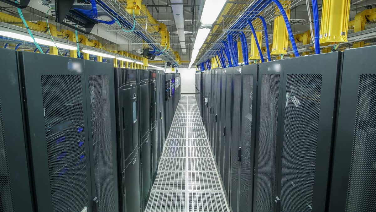 Rows of server racks in a data centre aisle